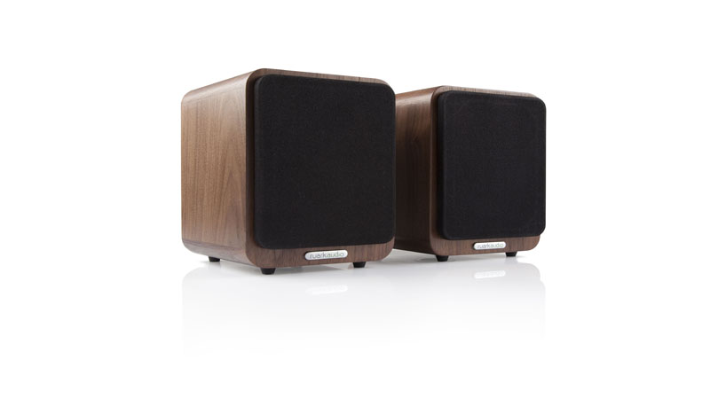 Most smartphones deliver second-rate audio quality but it doesn't have to be, especially when you have the <strong>Ruark Audio MR1</strong>. This Bluetooth speaker system is designed to be used for a variety of music sources, and not just your mobile phone. You can connect the device to TVs and even computers. However, no matter what you play and from what source, the MR1 will make it sound as good as possible. <h2>Better Audio From Your Smartphone With the Ruark Audio MR1</h2> The <strong>Ruark Audio MR1</strong> carries two compact speakers and they each measure at 170-millimeters in height by 130-millimeters in width. All the specifics for the electronics and amplification are housed within the right speaker while the signals are sent to the left with the accompanying coaxial cable. The speakers are housed within hand-crafted wooden cabinets that adds a luxurious feel to them. Most of this wooden material comes from the gorgeous Rich Walnut veneer. Still, if you're not a fan of the wooden finish, know that these speakers are also available in modern-looking black and white finishes as well. There are rounded edges that will appeal to the Apple generation of customers, while still being able to maintain a look to give old-school hi-fi fans something to like about. For the build quality on the <strong>Ruark Audio MR1 Bluetooth Speaker System</strong>, it is unsurprisingly good, if not even excellent. The speaker cabinets feel rigid and weighty. However, they are also placed with high-quality fittings such as sturdy rubber feet underneath and a rear panel that is made completely out of metal. There is a Bluetooth with apt-x connectivity feature which means that users are able to play CD-quality audio from compatible devices. Each speaker has a long-throw 75-millimeter subwoofer with a neodymium magnet system. While this does sound, look, and feel like a premium device, the price kind of reflects that notion as well as it costs more than traditional ferrite systems. Nonetheless, since it has a greater magnetic concentration, this will allow for better driver control. Another neat feature is that it has an Auto Standby Function. When connected to a TV, the speaker system will either wake up or sleep when you turn the television on or off. This functionality will also activate to make the system shut itself down after a period of inactivity. The <strong>Ruark Audio MR1</strong> is a very stylish and excellently-sounding Bluetooth speaker system which brings hi-fi finesse into the modern wireless world. It is able to deliver a full range of hi-fi listening experience from its compact speakers.