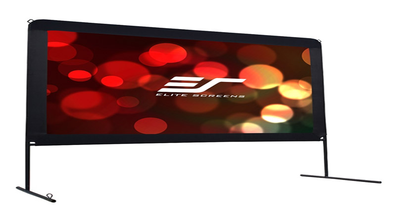 The <strong>Elite Screens Yard Master OMS100H</strong> is a large screen for when you have a projector and would even prefer to watch movies with family and friends out in the yard at night. Even if you do have a projector, you may be thinking that you can get by with a makeshift screen by just beaming the images onto a wall then closing down the lights. But then again, there is something enjoyable about watching movies and videos out in the yard with the people you're really close with. The OMS100H has advantages for that purpose, including a sturdy frame to hold everything together that can stand up to rain, sunlight, and even wind. <h2>Take Out Elite Screens Yard Master OMS100H for Family Outdoor Barbecues</h2> The <strong>Elite Screens Yard Master OMS100H</strong> is not as flimsy as most portable indoor screens. In fact, it is made to be durable to withstand various types of weather conditions. However, this durability comes with a bit of a price since it is more rugged and heavier as compared to portable indoor screens. One of the reasons is due to its coated steel frame that will also come with a base with feet. The base is sturdy enough so it won't top backward or forward easily. Furthermore, the entire kit comes with guy-lines and stakes to keep the screen standing, even when faced with moderate winds. The material of the screen is designed to withstand prolonged exposures to several types of weather, including bright sunlight and rain. Hence, if you're already tired after your late night part sessions out in the yard and don't want to clean up afterwards and want to leave everything there until tomorrow, you can do so with this screen. The <strong>Yard Master OMS100H</strong> is durable enough to withstand the elements, at least occasionally. The product instructions even says that it is designed for easy cleaning as it can be cleaned with just hand soap and water using a cotton cloth. Once you have everything set-up, you will have a 100-inch monster of a screen with a 16:9 aspect ratio. Now all you have to do is point your projector of choice onto the screen and you're ready to go. If you are in the market for a more portable indoor screen to complement your projector, then the <strong>Elite Screens Yard Master OMS100H</strong> is not the one you need. However, if you're the type to have weekly movie nights out in the yard, or one who likes to invite friends over to your backyard on a weekly basis for a bit of a barbecue, then this outdoor screen should be your prime choice.