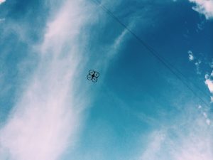 drone-flaying-through-blue-sky