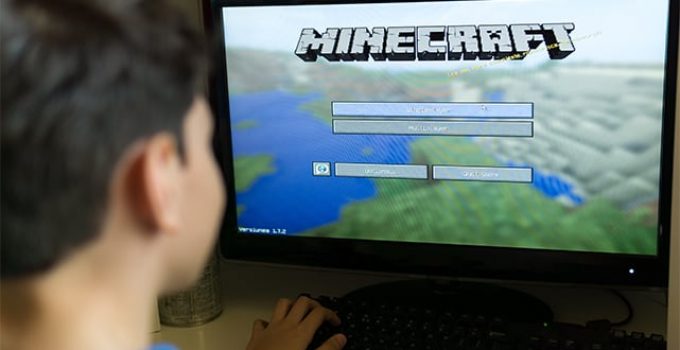 An image featuring a child playing Minecraft