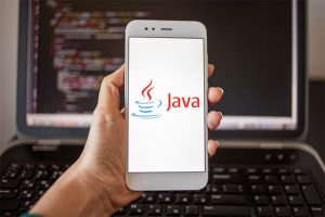 An image featuring java opened on phone and on laptop coding java programming language concept