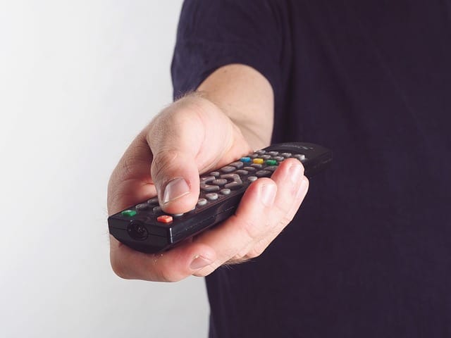 man holding remote control