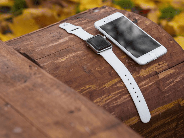 smartwatch beside smartphone